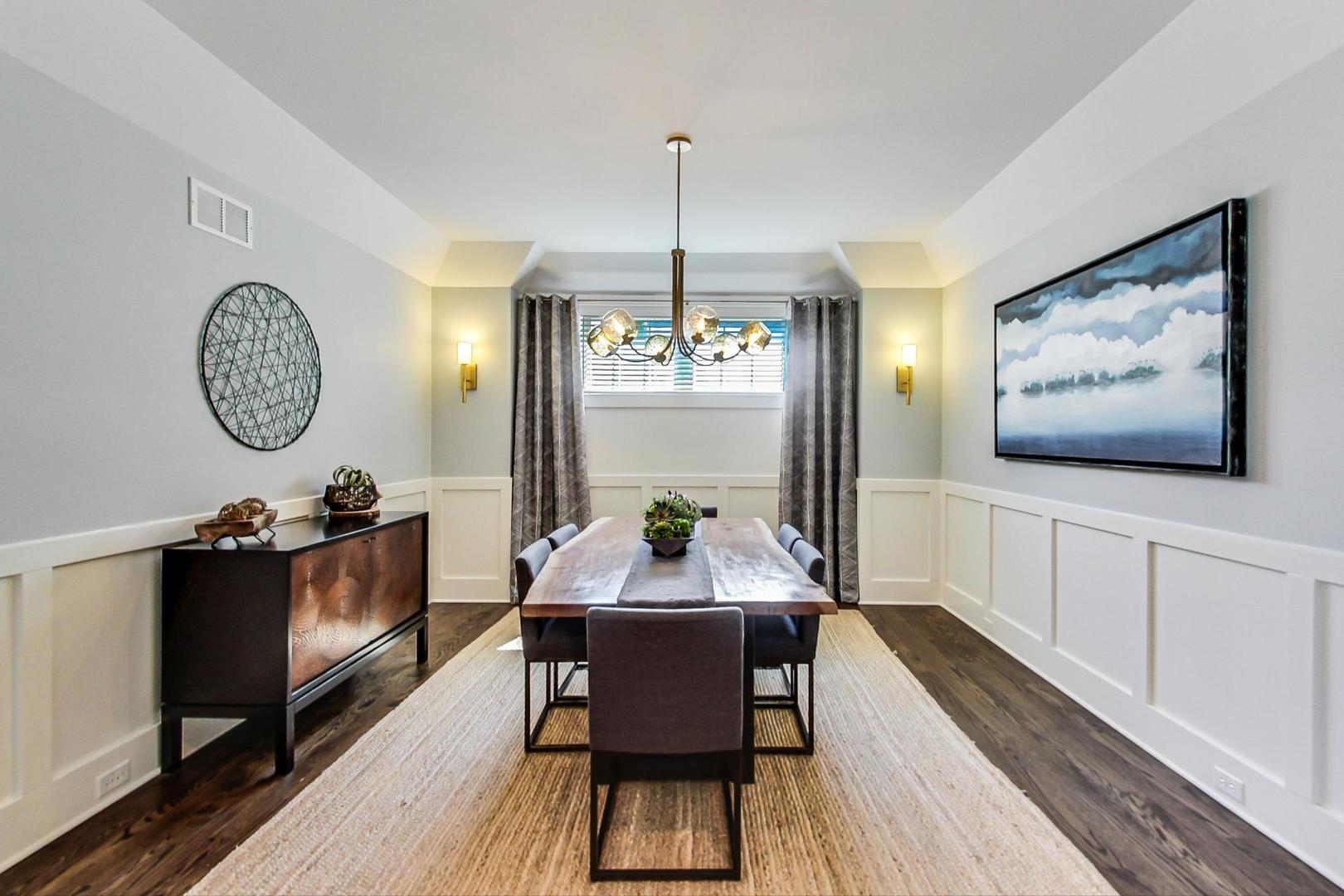 219 Clinton Avenue Elmhurst, IL 60126 - Photo 7 of 49 a view of a dining room with furniture window and wooden floor