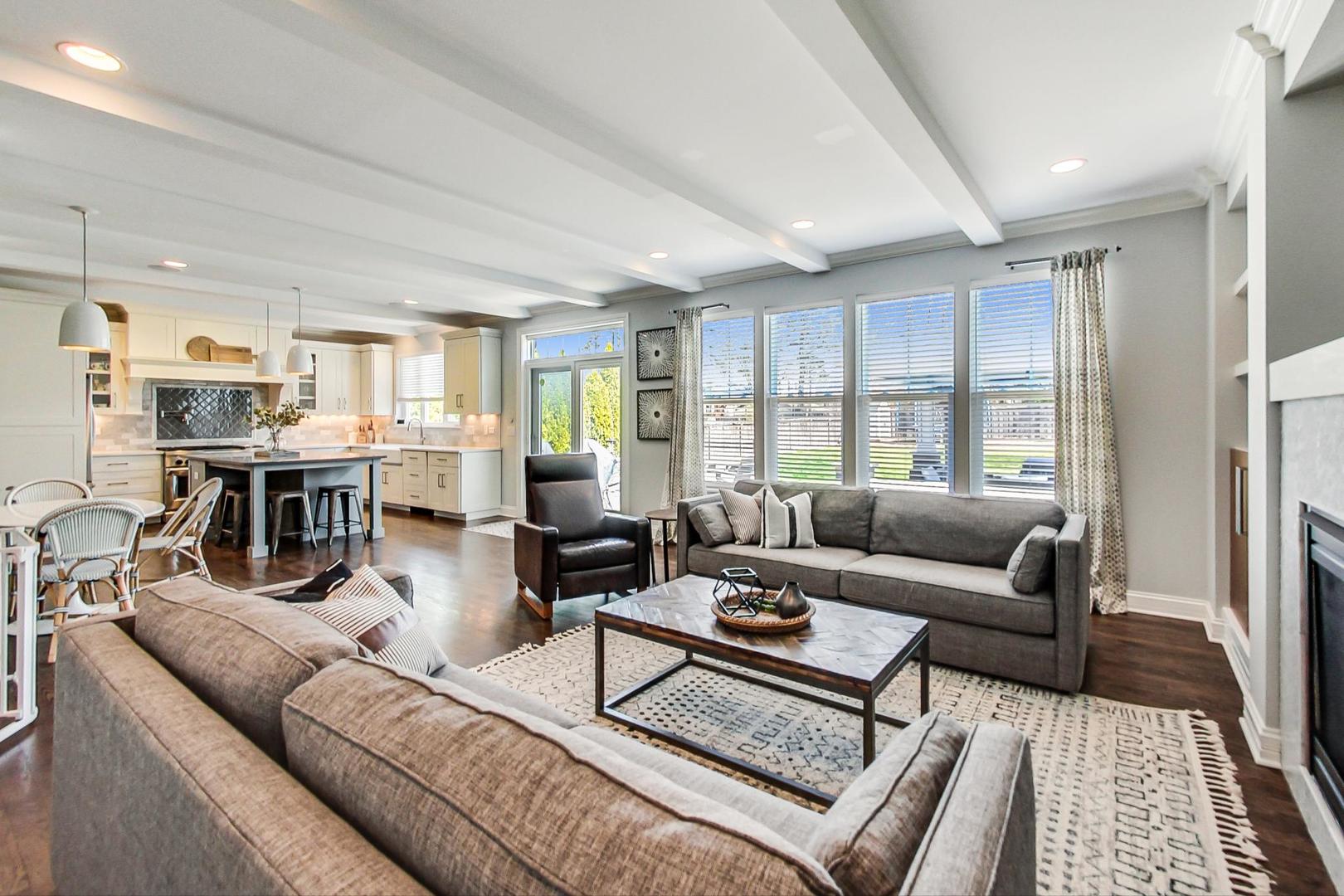 219 Clinton Avenue Elmhurst, IL 60126 - Photo 9 of 49 a living room with furniture and a large window