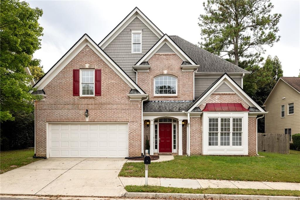 3263 Emerald Brook Lane Decatur, GA 30033 - Photo 1 of 1 a front view of a house with garden