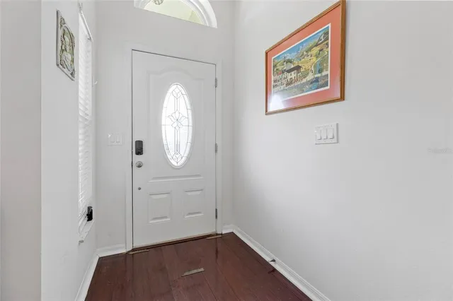 a view of a hallway with front door