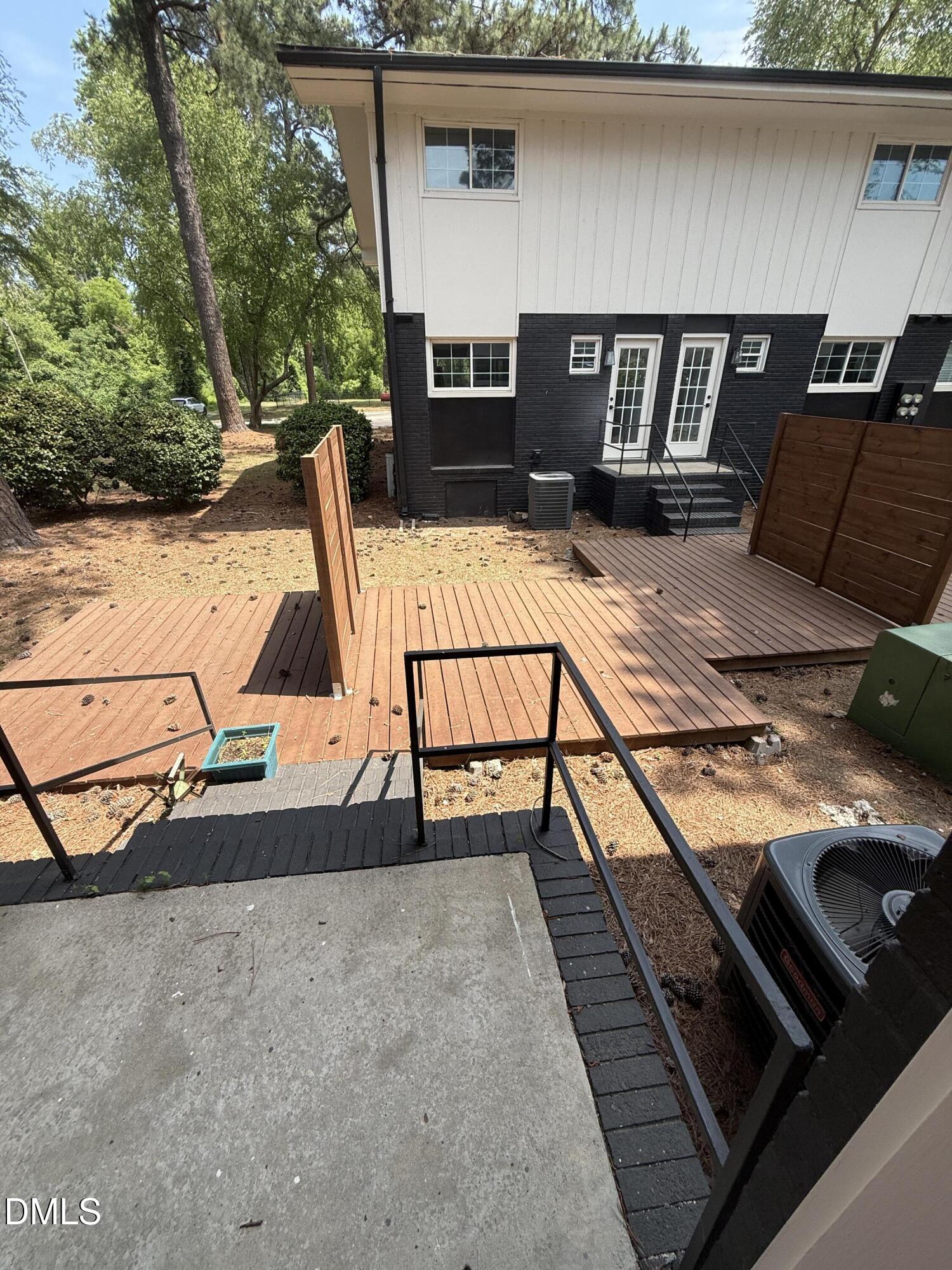 2616 Noble Road, Unit D Raleigh, NC 27608 - Photo 9 of 9 a roof deck with table and chairs