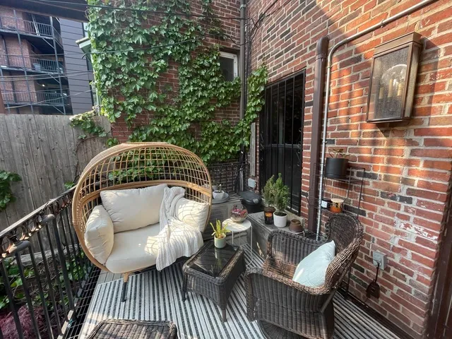 a roof deck view with a seating space