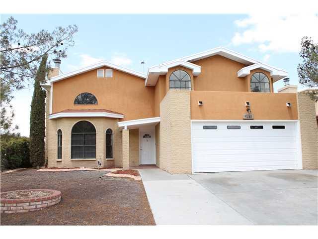 7401 Lakehurst Road El Paso, TX 79912 - Photo 1 of 1 a view of a house with a yard and garage