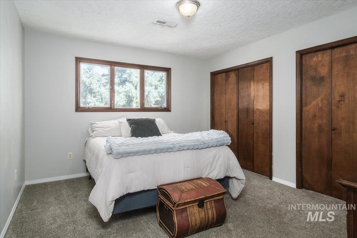 1401 Chokecherry Drive Pocatello, ID 83204 - Photo 30 of 46 Room featuring light gray walls and gray carpeting