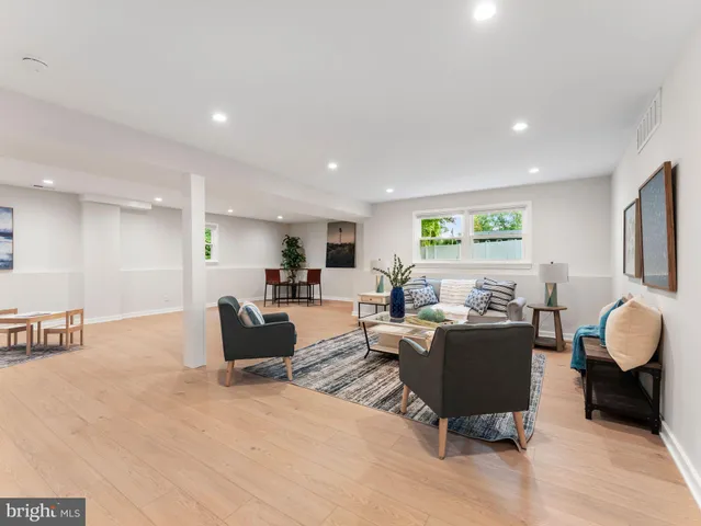 a living room with furniture window and a window