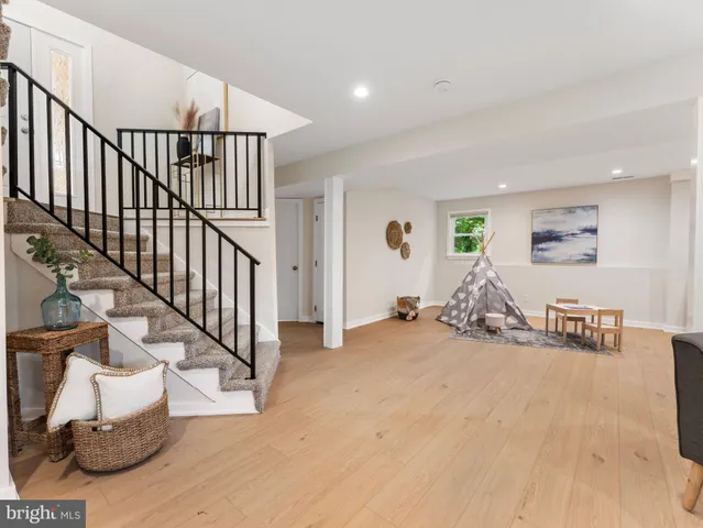 a view of a livingroom with furniture and stairs