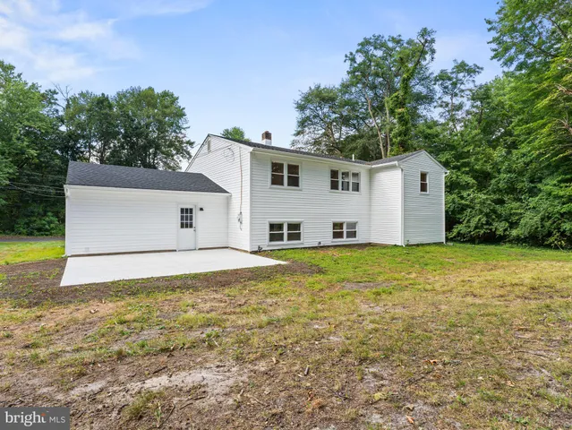 a view of a swimming pool with an outdoor space and seating area