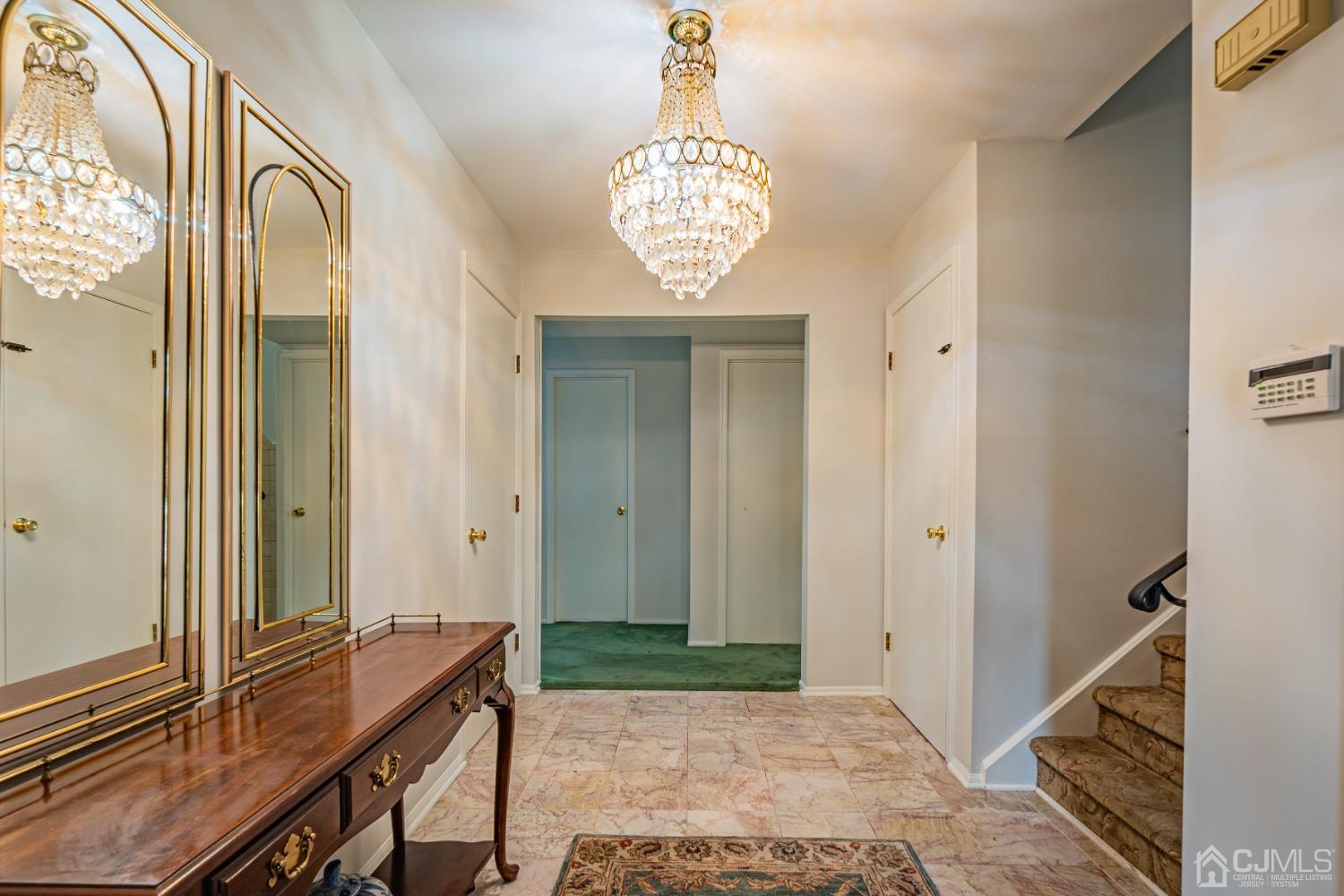 7 Meredith Road Edison, NJ 08817 - Photo 6 of 35 a view of an entryway with a chandelier