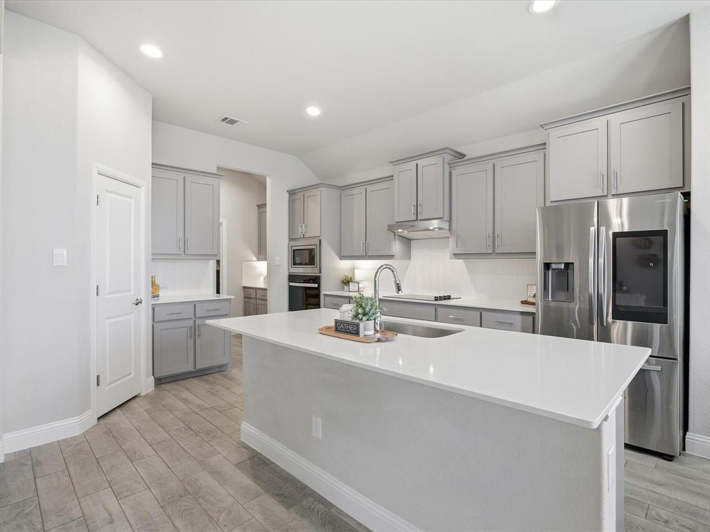 1006 Fairhaven Drive Midlothian, TX 76065 - Photo 39 of 40 Spacious open floorplan kitchen with island and walk-in pantry