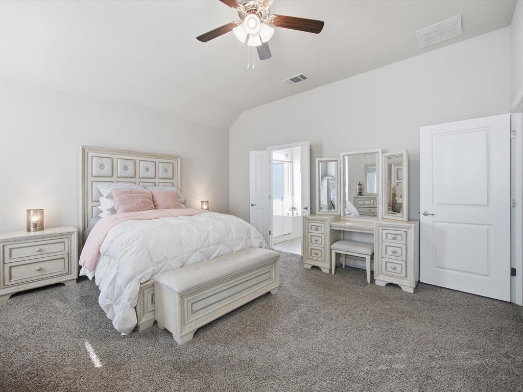 1006 Fairhaven Drive Midlothian, TX 76065 - Photo 10 of 40 Spacious primary bedroom with ensuite bathroom and walk-in closet