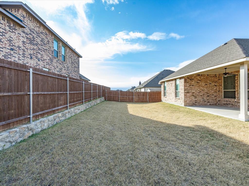 1006 Fairhaven Drive Midlothian, TX 76065 - Photo 28 of 40 Backyard view of large corner lot home