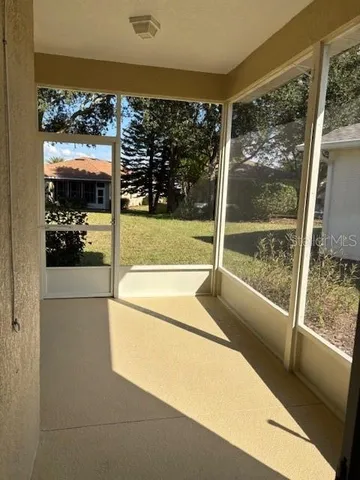 a view of a room with a large window