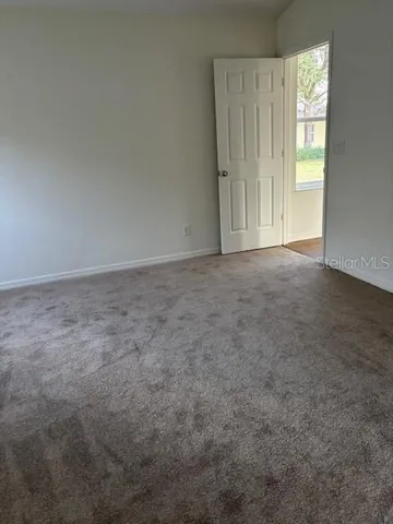 a view of an empty room and window