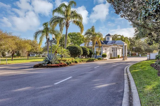 a view of a street with houses on both side