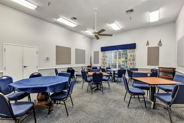 a view of a dining room with furniture and window