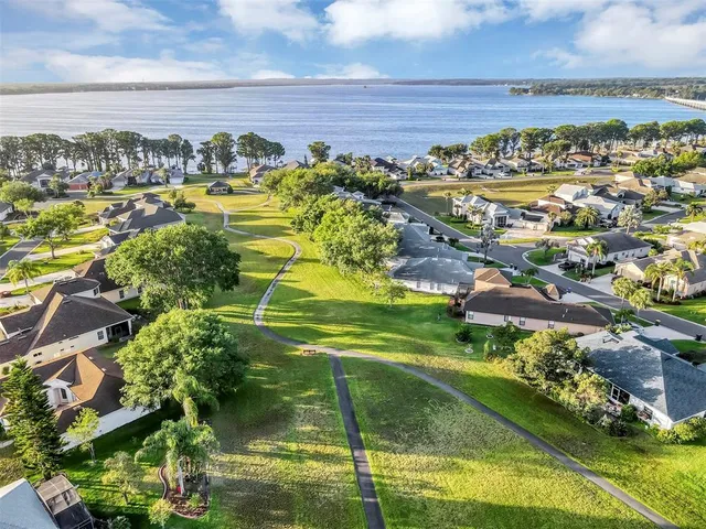a view of a lake with a yard