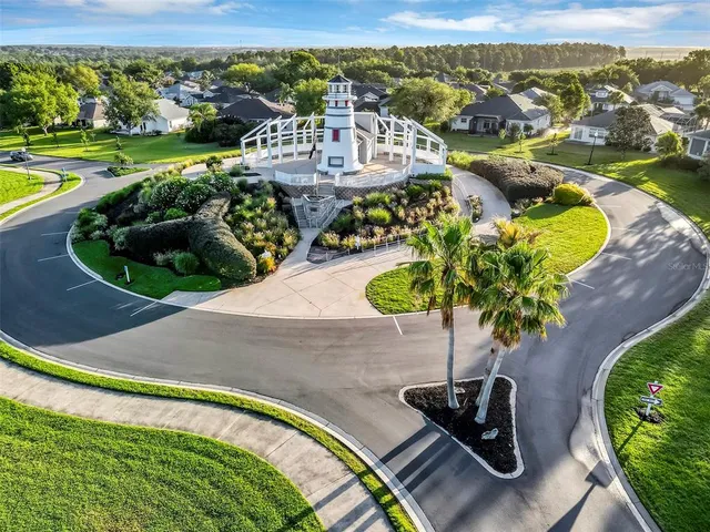a view of a swimming pool with a patio and a garden