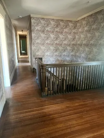 a view of entryway with wooden floor