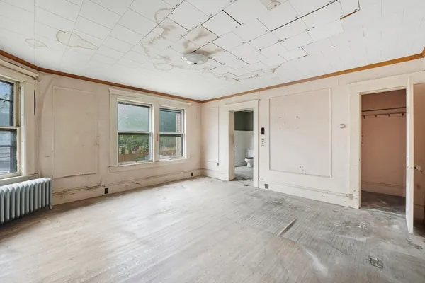 an empty room with windows