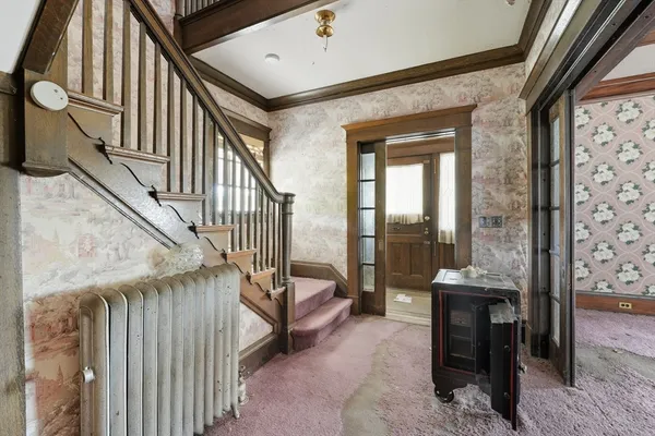 a view of entryway livingroom and hall