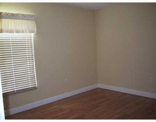 17241 Southwest 285th Street Homestead, FL 33030 - Photo 11 of 14 a view of a small space with wooden floor and a window