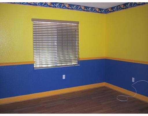 17241 Southwest 285th Street Homestead, FL 33030 - Photo 7 of 14 a view of an empty room with a window