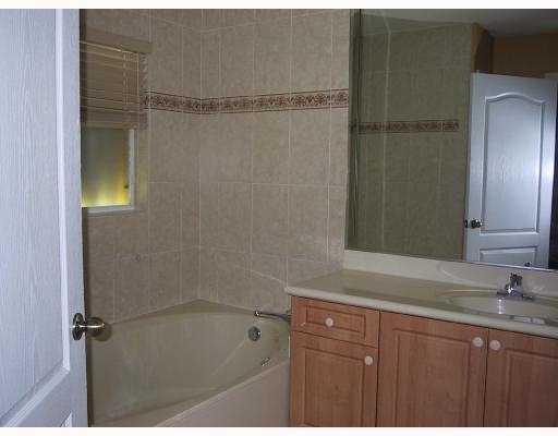 17241 Southwest 285th Street Homestead, FL 33030 - Photo 10 of 14 a bathroom with a granite countertop sink mirror and shower