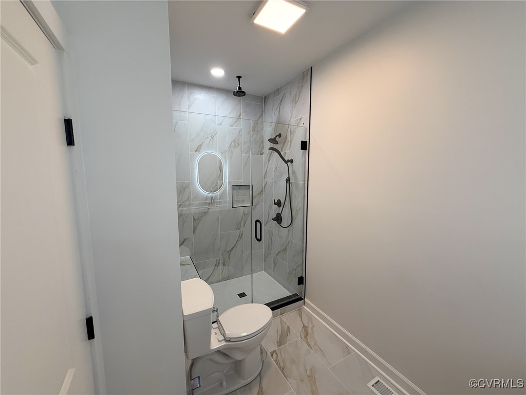745 Robertsons Road Blackstone, VA 23824 - Photo 18 of 42 Bathroom featuring toilet, a marble finish shower,