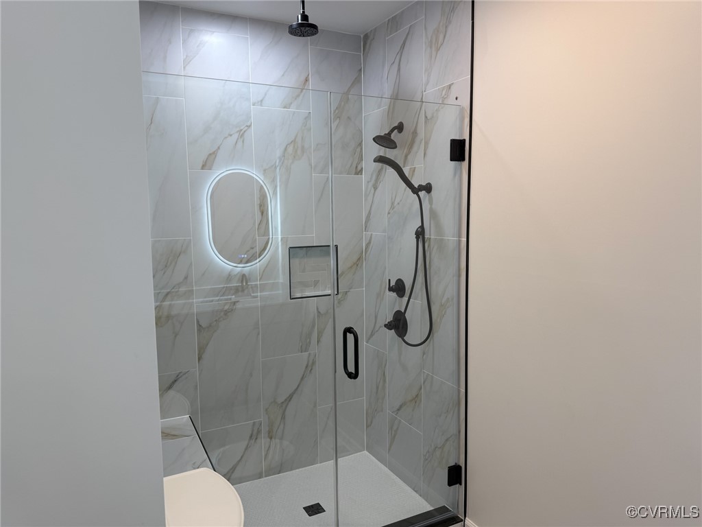 745 Robertsons Road Blackstone, VA 23824 - Photo 19 of 42 Bathroom featuring toilet and a shower stall