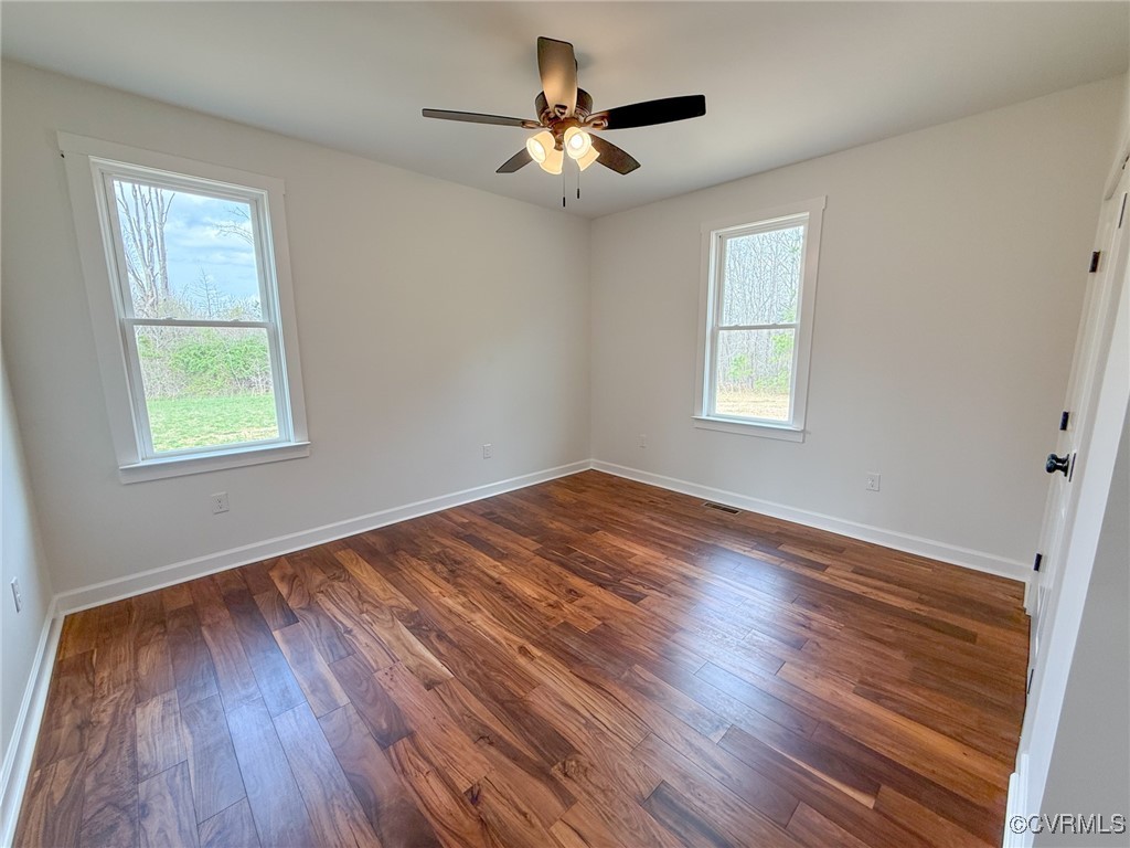 745 Robertsons Road Blackstone, VA 23824 - Photo 27 of 42 Empty room featuring dark wood-style floors, visib