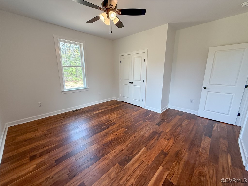 745 Robertsons Road Blackstone, VA 23824 - Photo 28 of 42 Unfurnished bedroom with dark wood-style floors, b