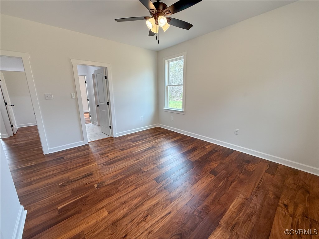 745 Robertsons Road Blackstone, VA 23824 - Photo 30 of 42 Unfurnished bedroom featuring baseboards, wood fin