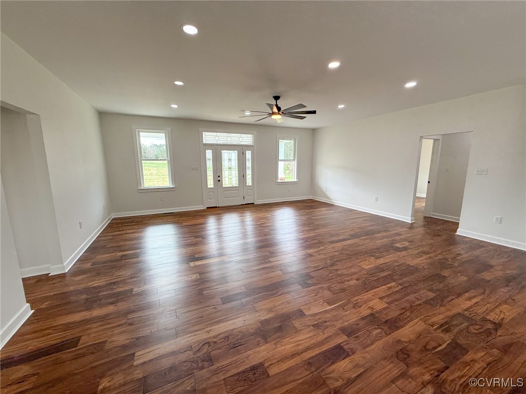 745 Robertsons Road Blackstone, VA 23824 - Photo 3 of 42 Empty room with dark wood-type flooring, baseboard