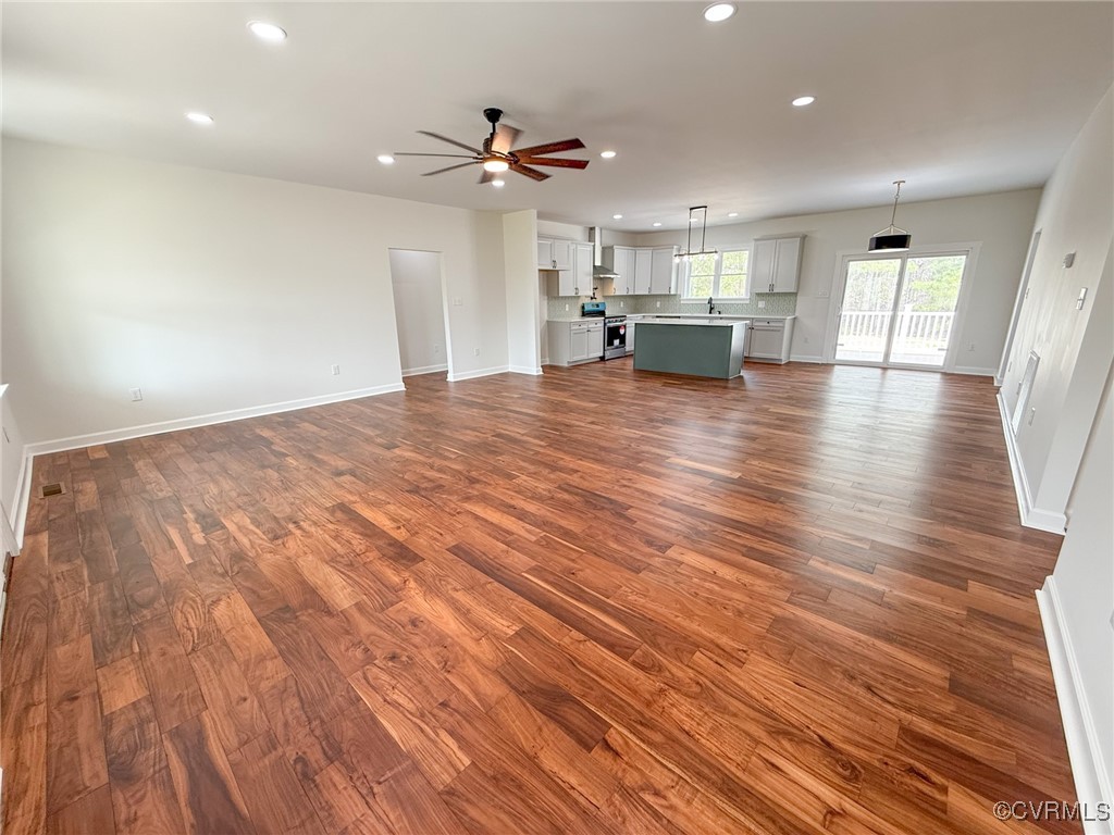745 Robertsons Road Blackstone, VA 23824 - Photo 8 of 42 Unfurnished living room with dark wood-style floor