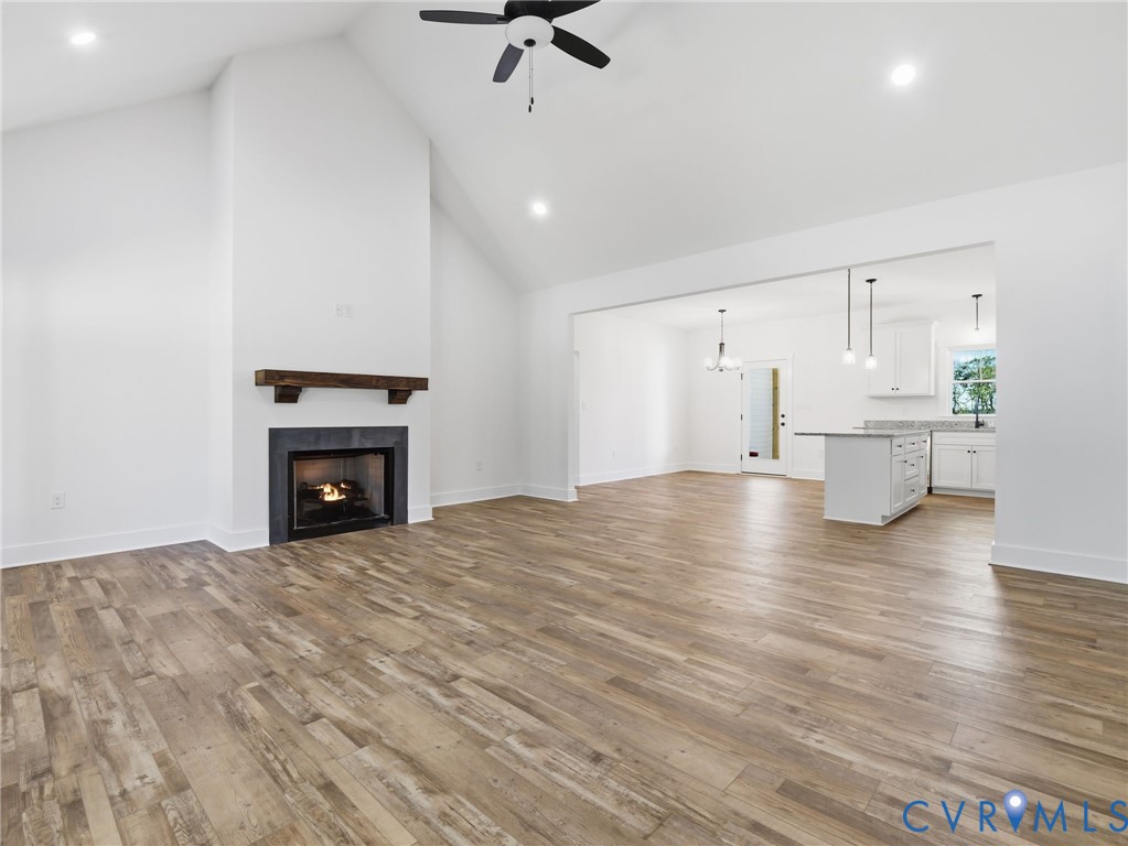 4301 Worsham Road Powhatan, VA 23139 - Photo 11 of 33 a view of empty room with wooden floor and fireplace