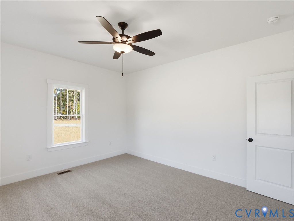 4301 Worsham Road Powhatan, VA 23139 - Photo 15 of 33 an empty room with windows and fan