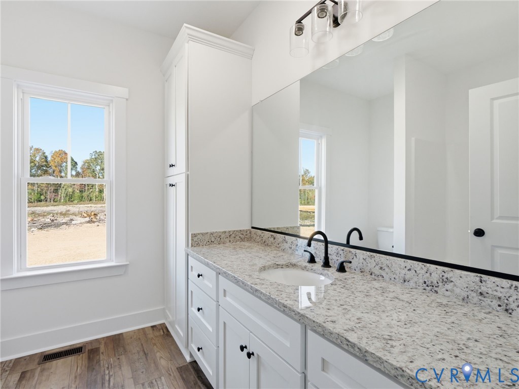 4301 Worsham Road Powhatan, VA 23139 - Photo 20 of 33 a bathroom with a sink and a mirror