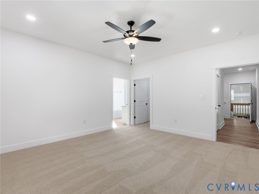 4301 Worsham Road Powhatan, VA 23139 - Photo 22 of 33 an empty room with closet and ceiling fan