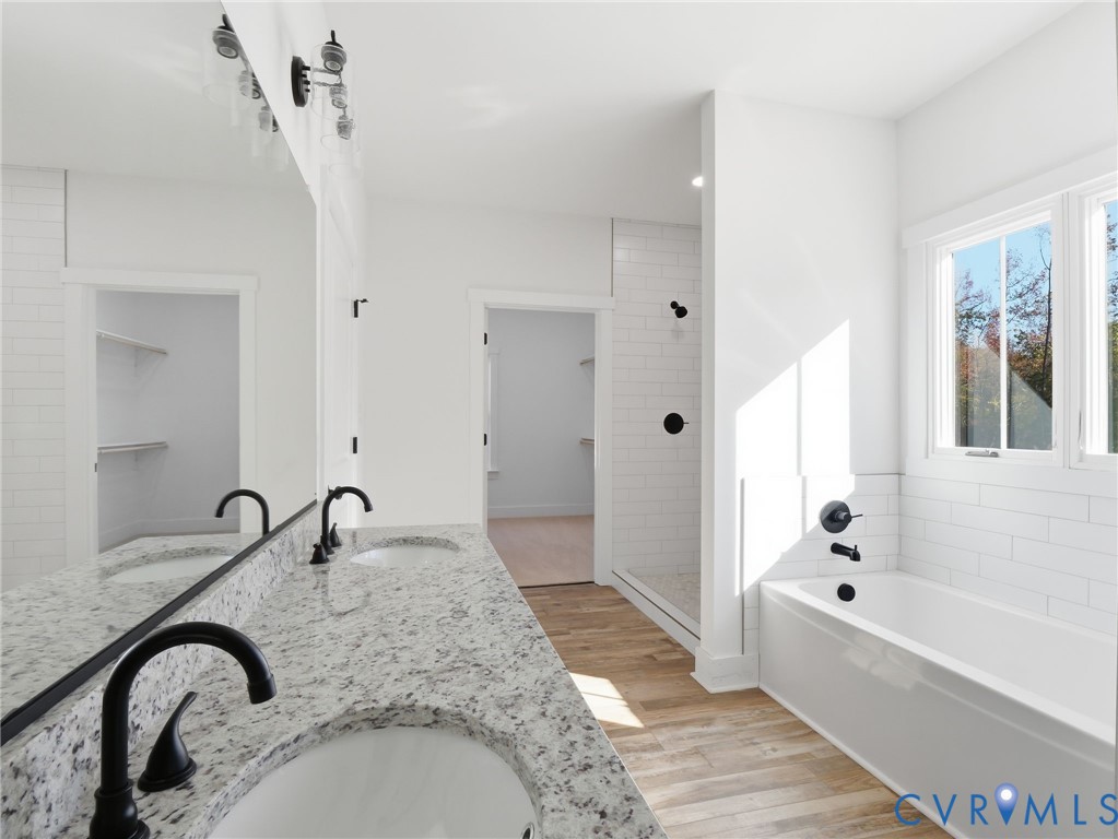 4301 Worsham Road Powhatan, VA 23139 - Photo 24 of 33 a bathroom with a bathtub and a shower