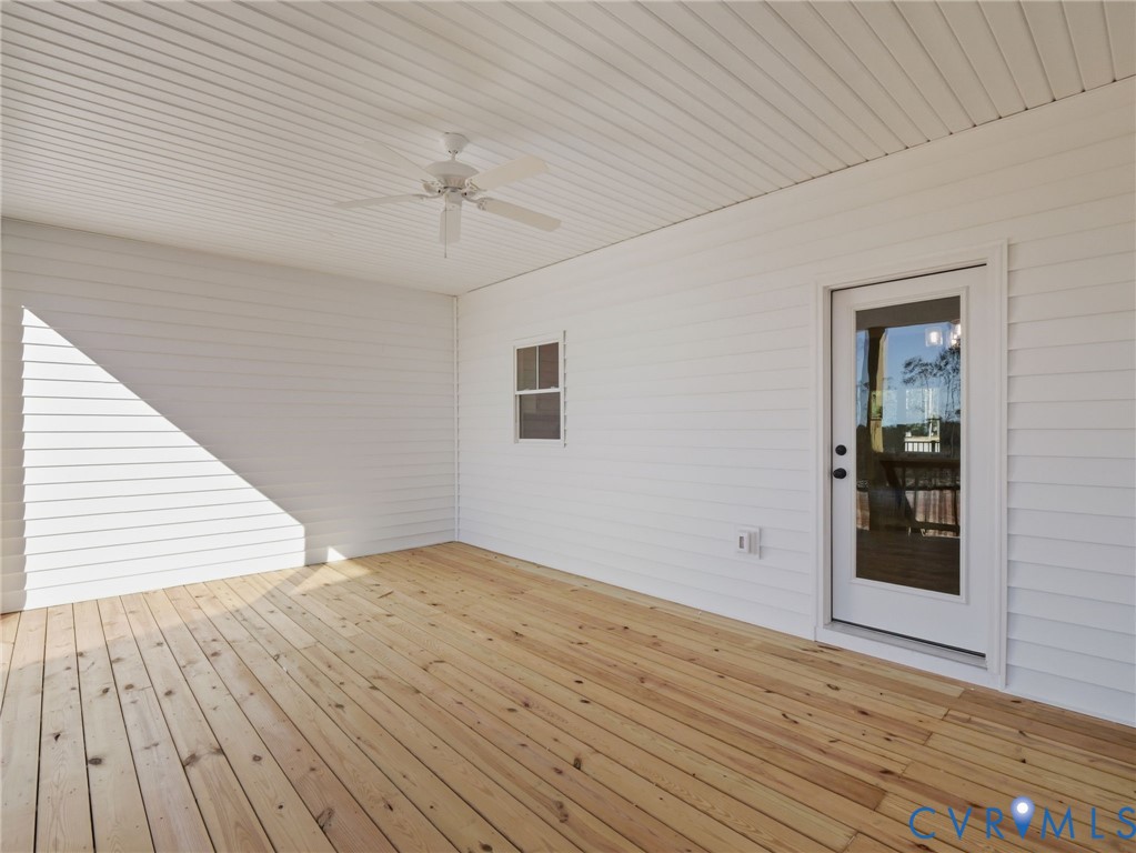 4301 Worsham Road Powhatan, VA 23139 - Photo 31 of 33 a view of an empty room with wooden floor and a ceiling fan