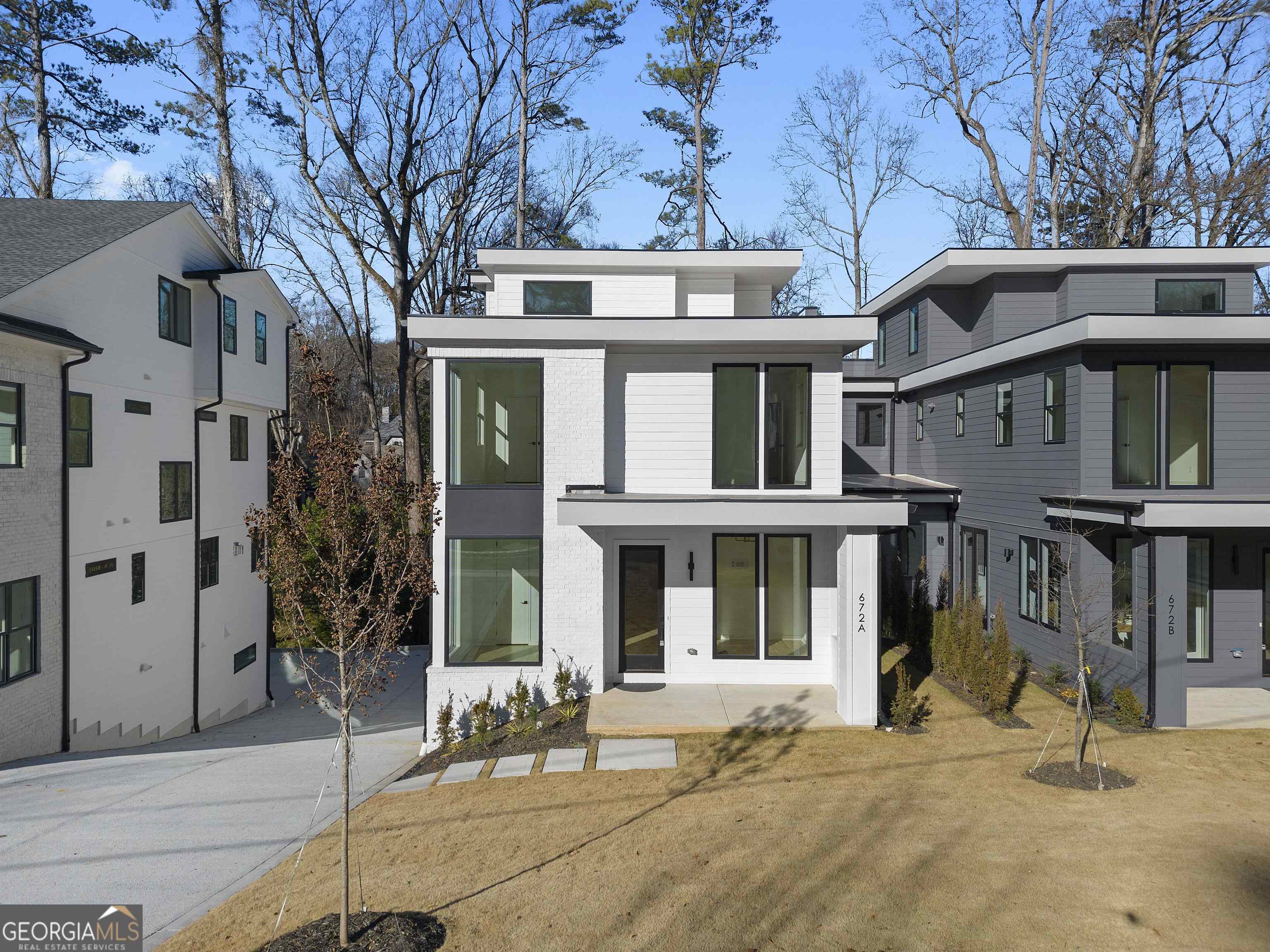 672 Timm Valley Road Northeast, Unit A Atlanta, GA 30305 - Photo 1 of 1 a front view of a house with a tree