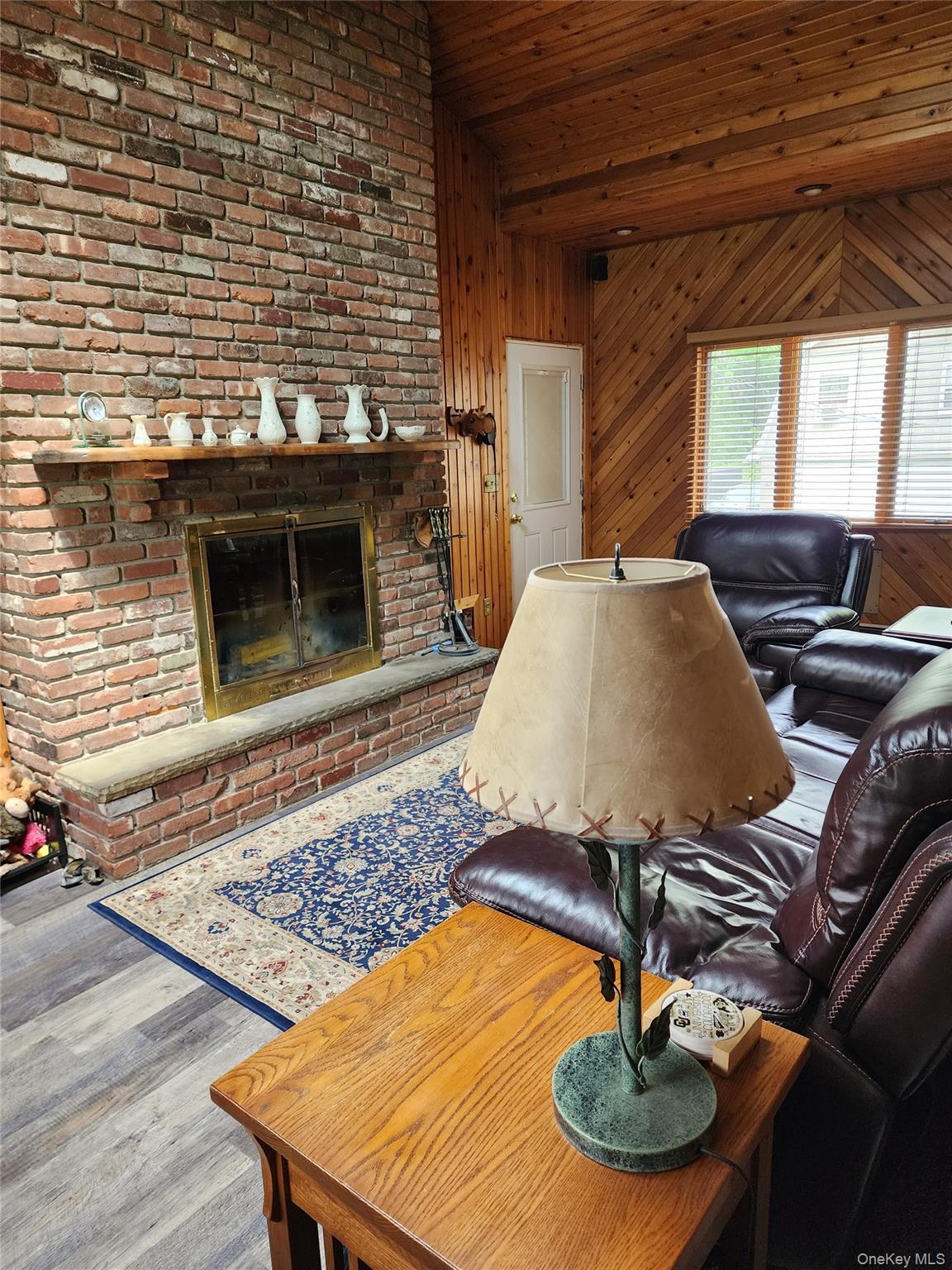 46 Cortlandt Road Mahopac, NY 10541 - Photo 12 of 32 Den with entrance to garage Stone fireplace