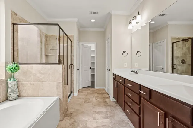 a spacious bedroom with a bed and a large window