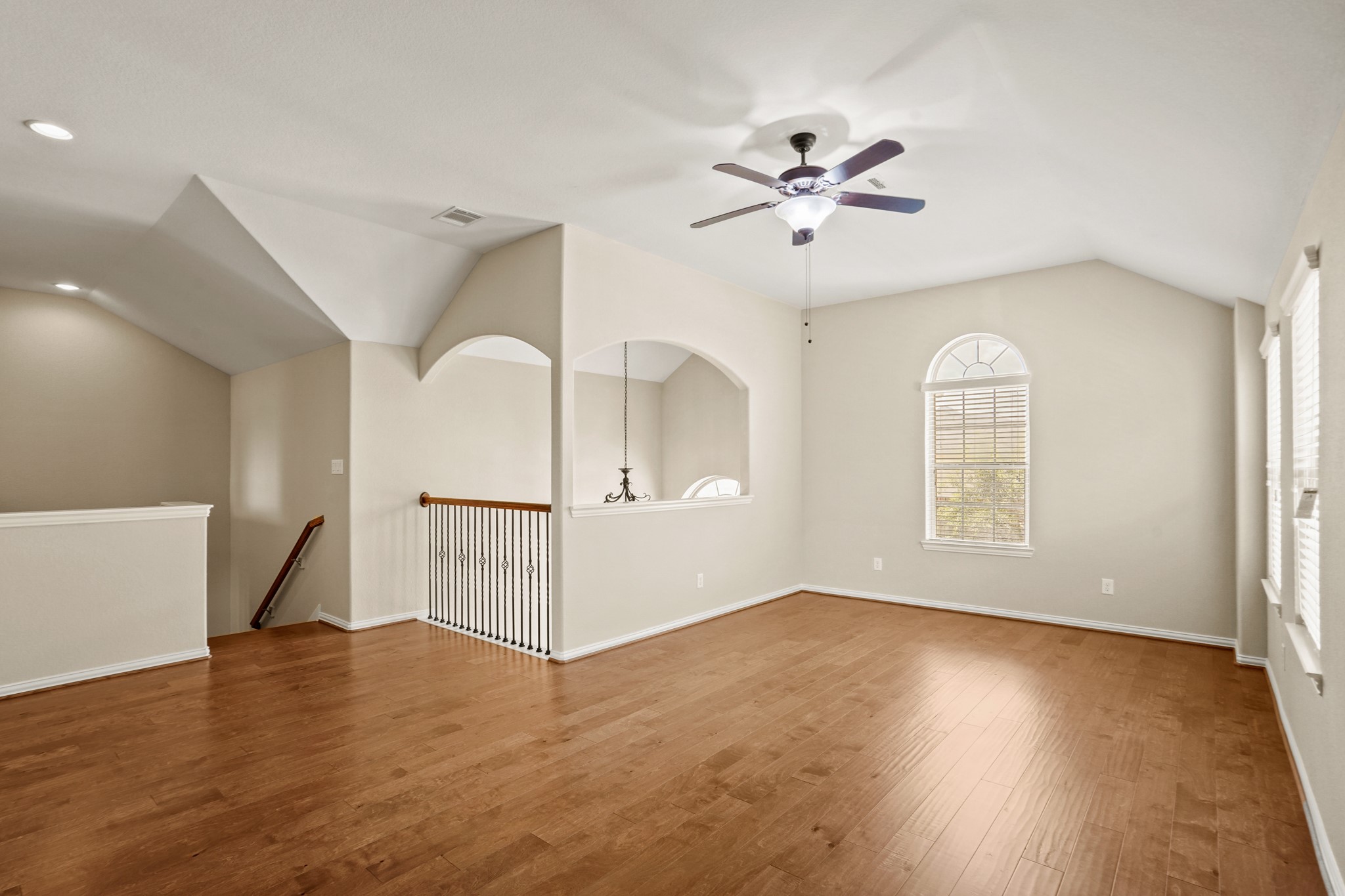 3414 Satton Ranch Lane Fulshear, TX 77441 - Photo 14 of 28 a view of an empty room with wooden floor and a window