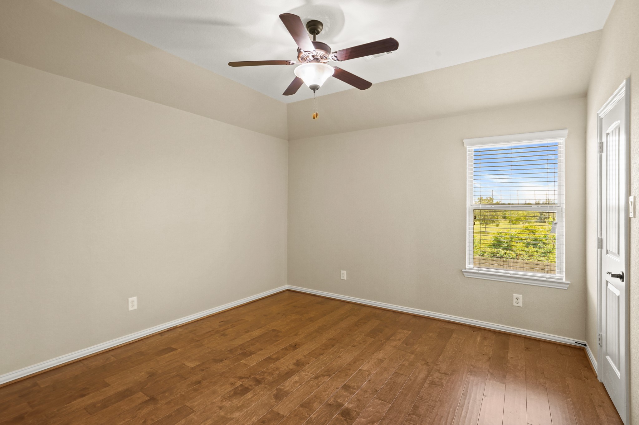 3414 Satton Ranch Lane Fulshear, TX 77441 - Photo 16 of 28 an empty room with a window and a ceiling fan