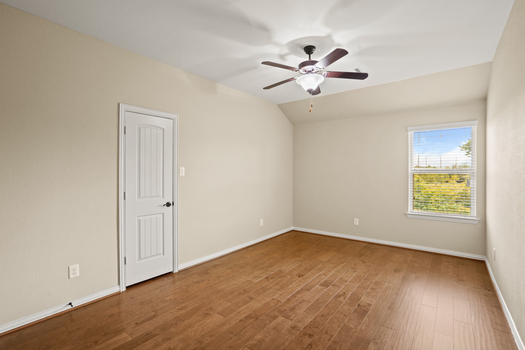 3414 Satton Ranch Lane Fulshear, TX 77441 - Photo 18 of 28 a view of empty room with wooden floor and fan