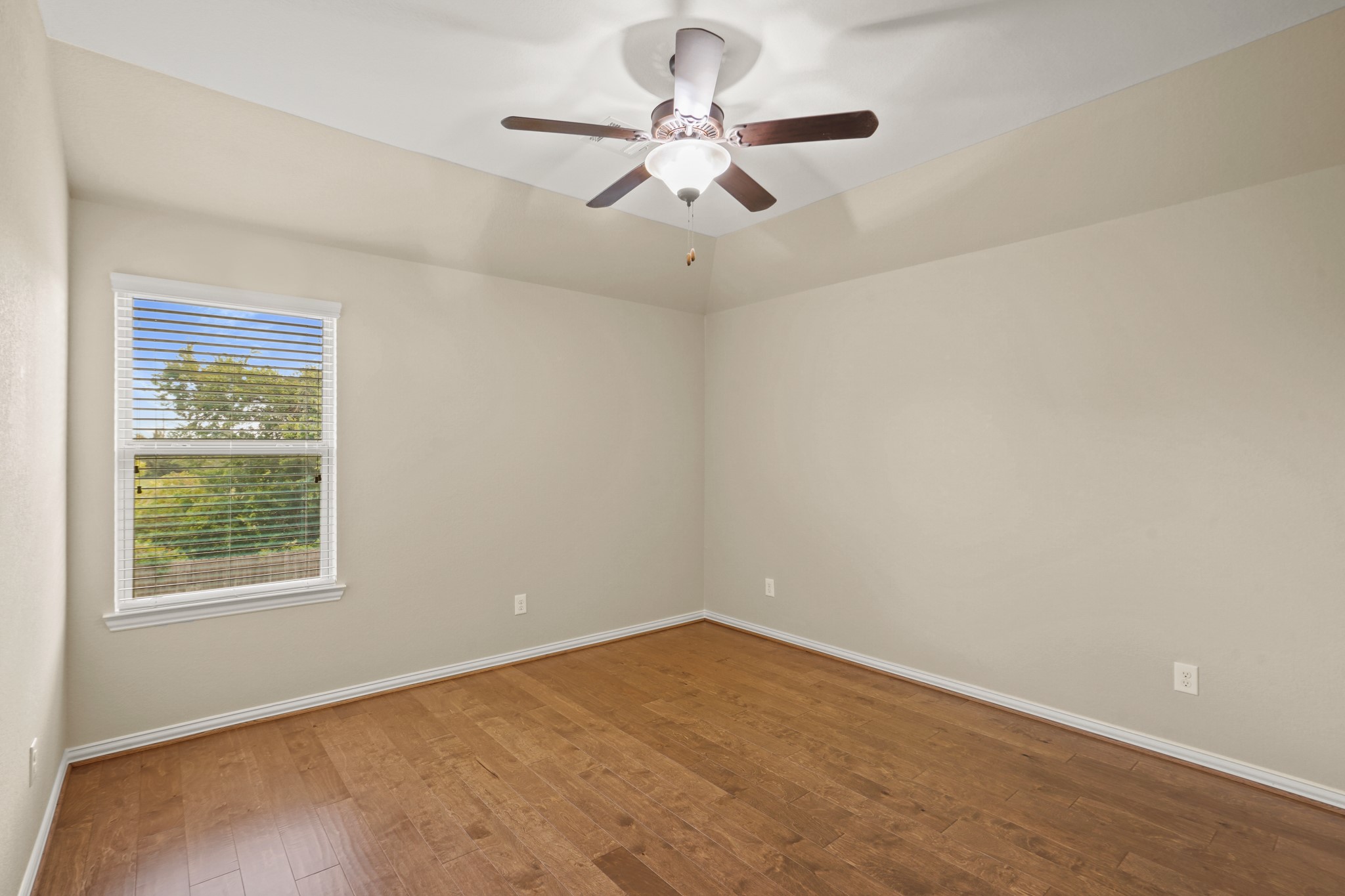 3414 Satton Ranch Lane Fulshear, TX 77441 - Photo 19 of 28 an empty room with windows and fan