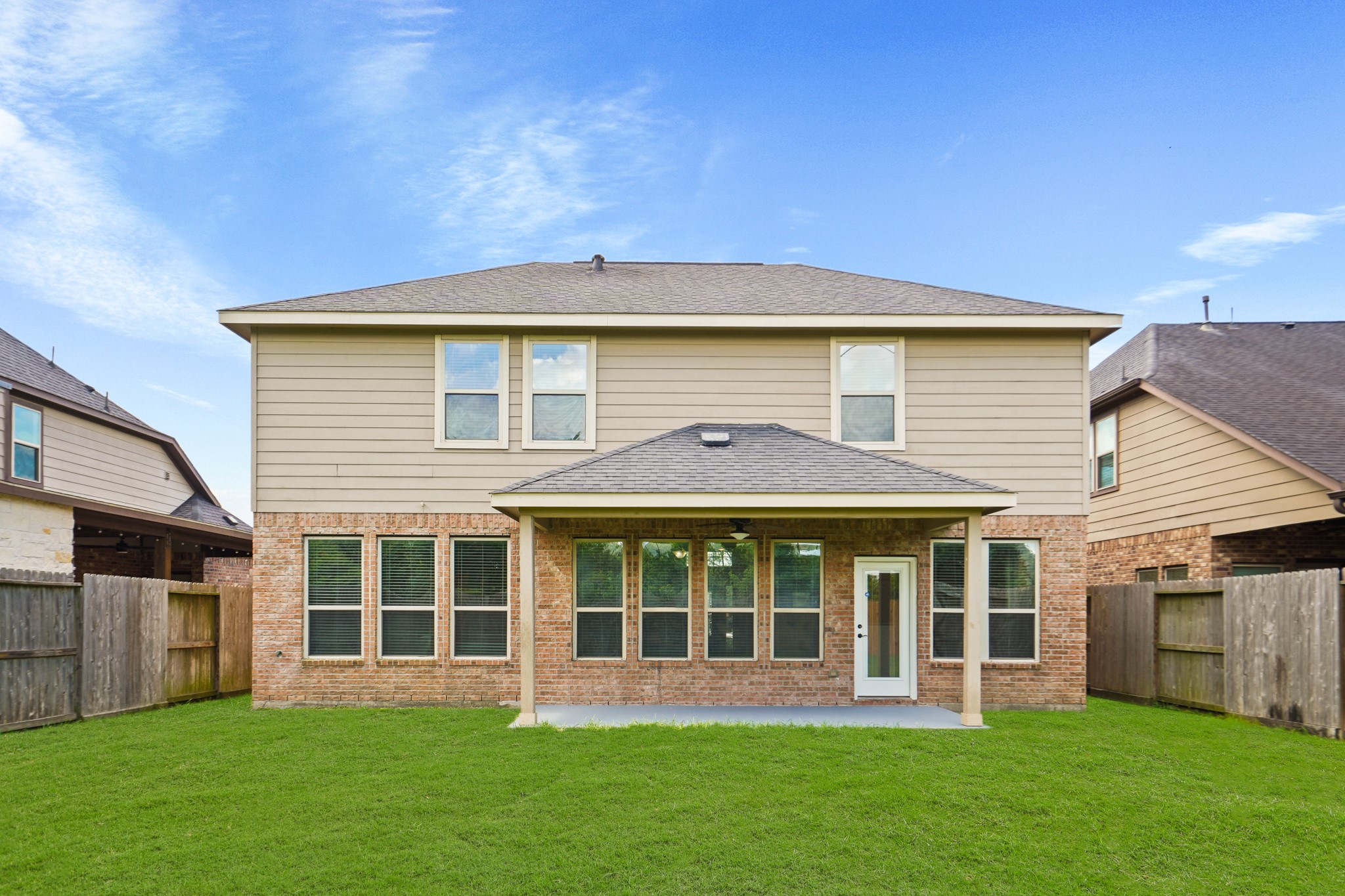 3414 Satton Ranch Lane Fulshear, TX 77441 - Photo 22 of 28 a front view of a house with a yard