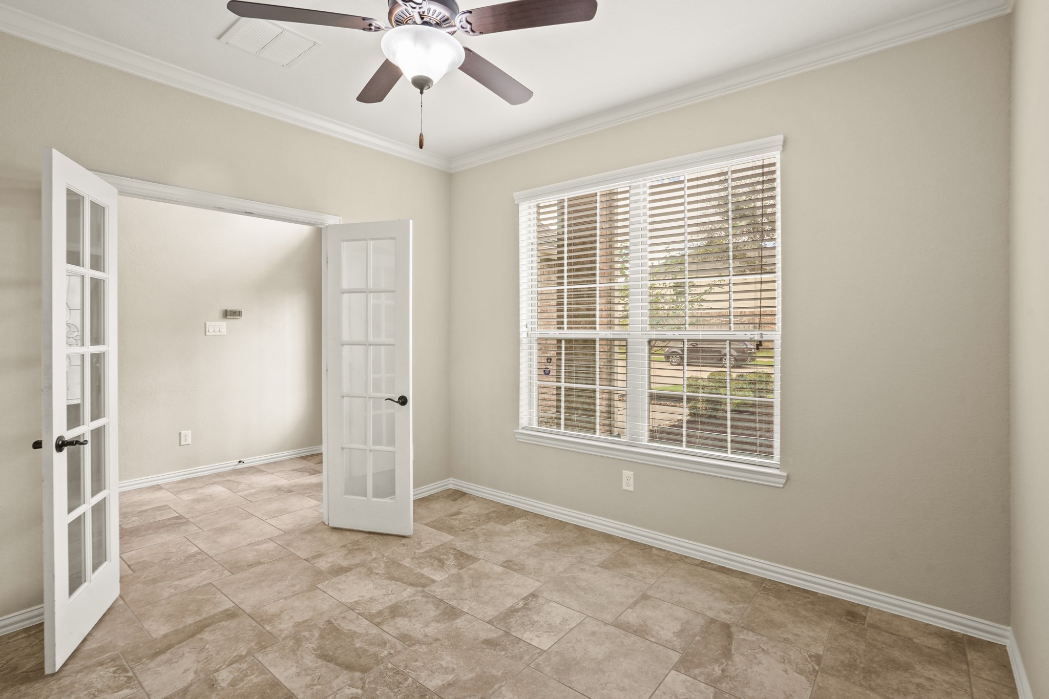 3414 Satton Ranch Lane Fulshear, TX 77441 - Photo 5 of 28 a view of an empty room with a window