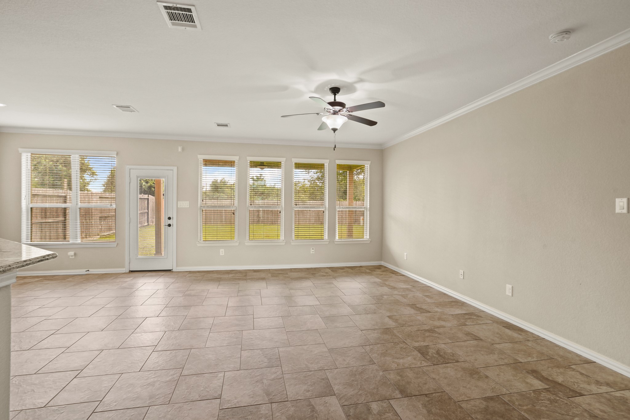 3414 Satton Ranch Lane Fulshear, TX 77441 - Photo 6 of 28 a view of an empty room with a window